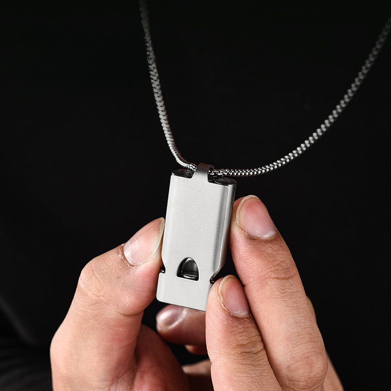 High-decibel outdoor emergency whistle made of titanium alloy